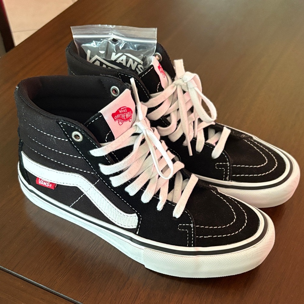 Vans Black and White High-Tops with Pink Accents